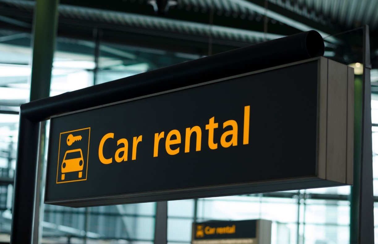 image of a sign that says car rental