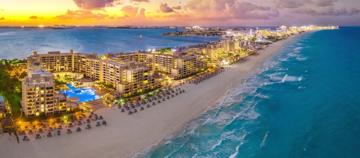 image of cancuns lights at sunset with a view of the surrounding waters